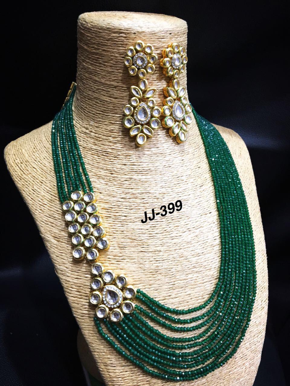 Beautiful kundan long set with green moti