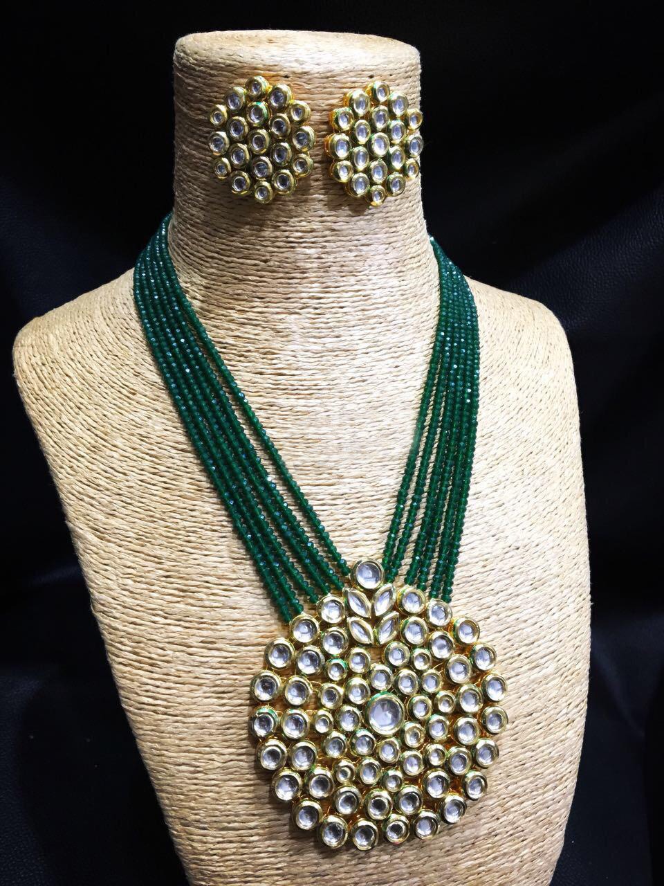 Kundan with green moti set