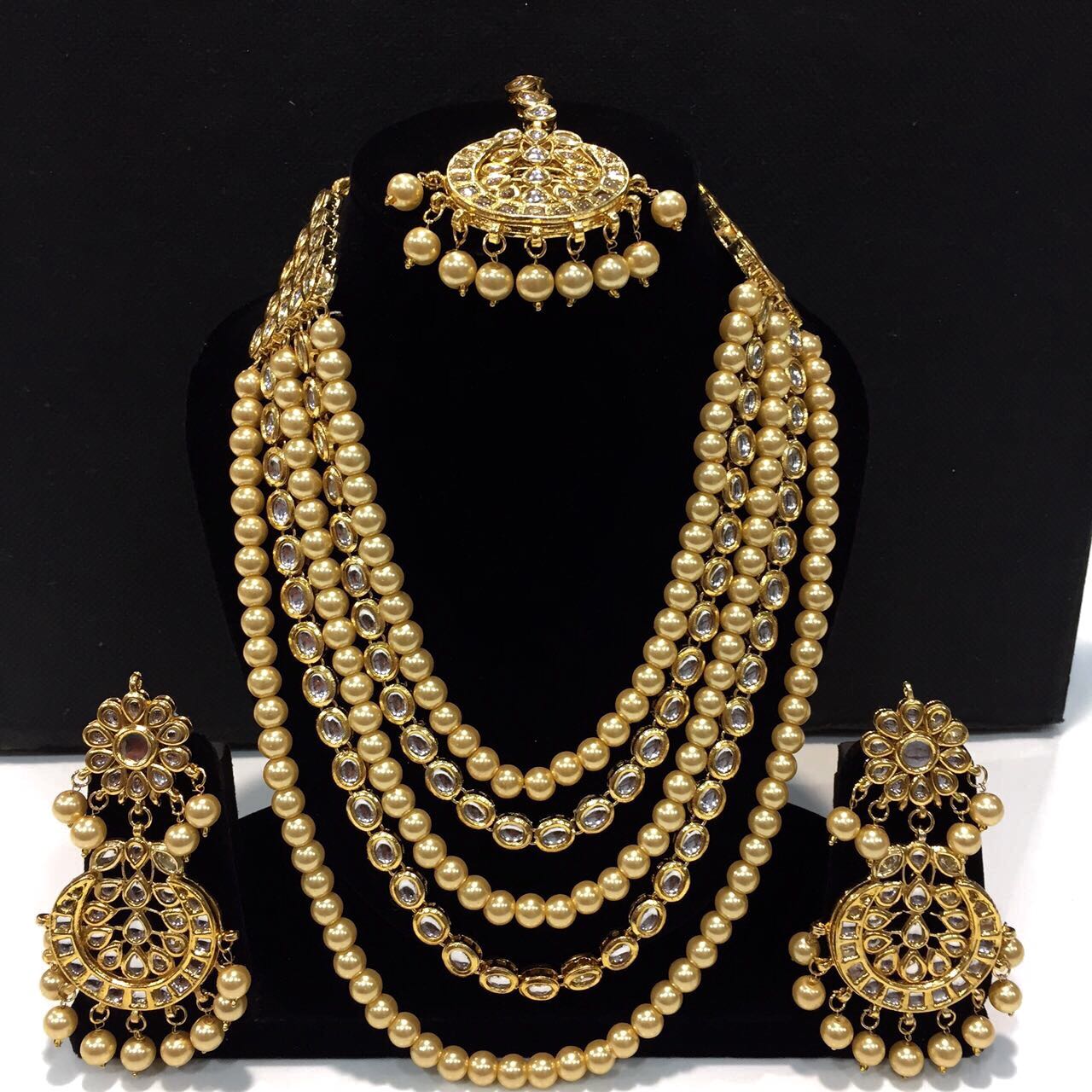 Golden color Kundan long set with maang teeka