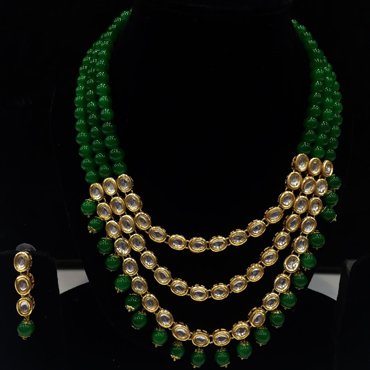 Beautiful Kundan long set with green color beads