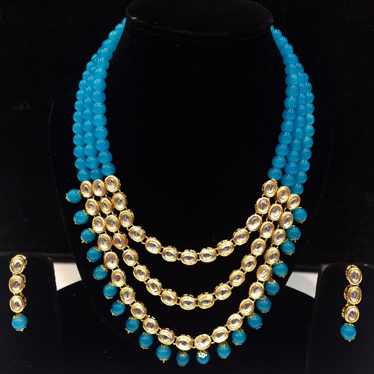 Beautiful Kundan long set with cyan colors beads