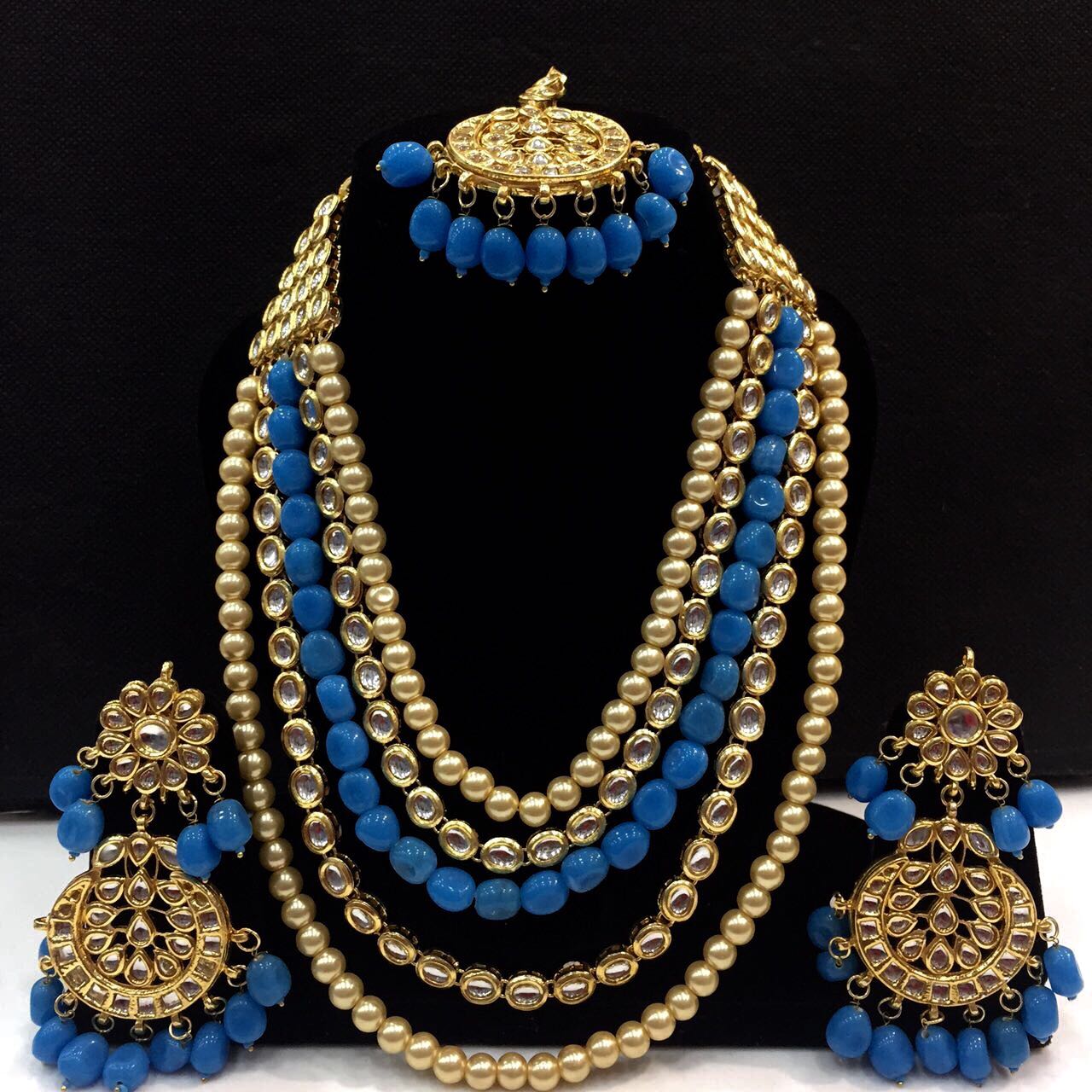 Kundan set with cyan and golden beads