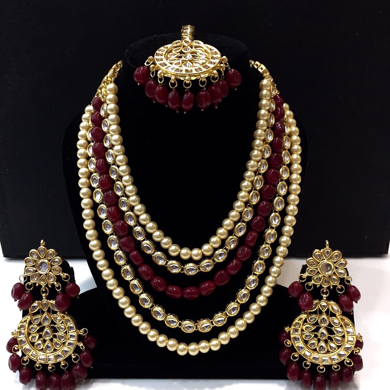 Kundan set with maroon and golden beads
